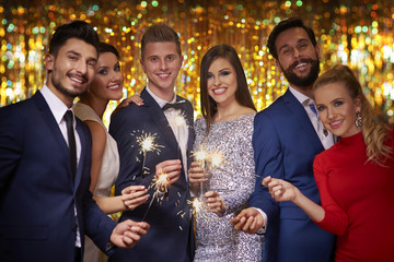 Group of friends with fireworks
