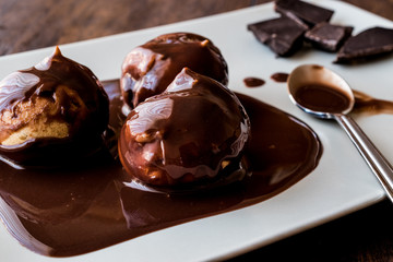 Profiteroles with chocolate cream.