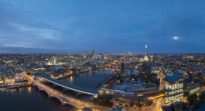 A night-time panoramic view of London and the River Thames from the top of the Southbank Tower showing The Shard and St. Paul's Cathedral, London