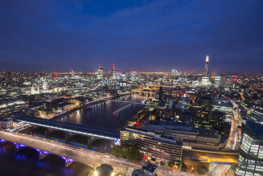 A night-time view of London and the River Thames from the top of Southbank Tower including The Shard, St. Paul's Cathedral and Tate Modern, London