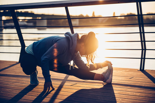 Woman streching by the river