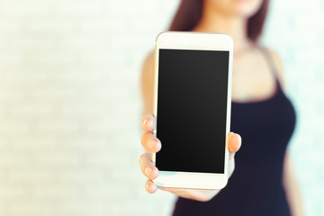 Woman with modern mobile phone in hands