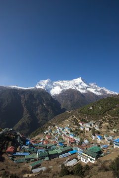 Namche Bazaar is the last town during the trek to Everest Base Camp, seen here with Kongde peak, Khumbu (Everest) Region, Nepal, Himalayas