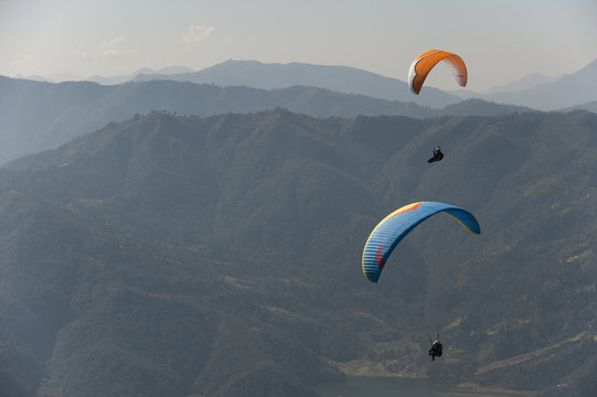 Paragliders flying above Pokhara, Nepal, Himalayas