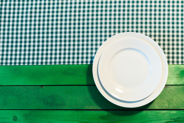the plate on checkered table cloth