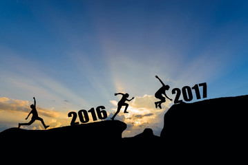 man jump between 2016 and 2017 years on sunset background.
