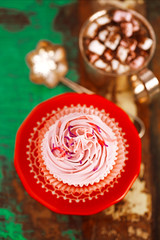 cupcake with hot chocolate on wooden table