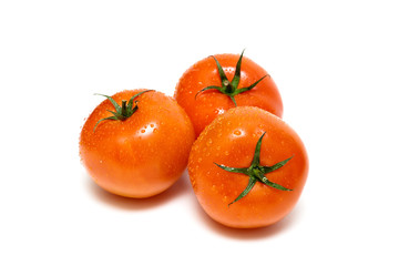 fresh ripe tomatoes isolated on white background