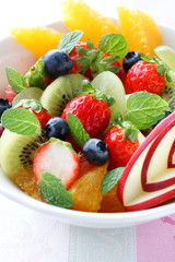 フレッシュフルーツサラダ,A bowl of healthy fresh fruit salad with carved from apple