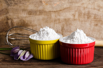 Wheat flour in a bowl on wooden background,food ingredient,prepare for cooking or baking