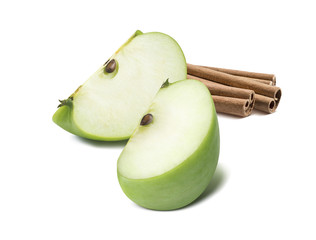 Green apple quarters cinnamon isolated on white background