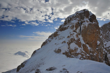 Mountain peaks over the clouds. Aladaglar Range, Central Taurus Mountains, Turkey. - 129657173
