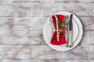 Christmas And New Year Holiday Table Setting. Top view, white wooden background. Winter holiday concept