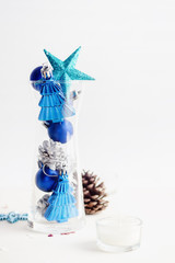 blue and silver Fir-cones and christmas toys in glass