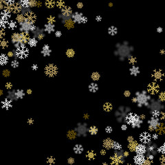 Snowfall background with golden snowflakes blurred in the dark