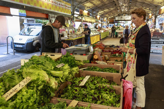 Shopping at Marche Provencal, morning market, Vieil Antibes, French Riviera, Cote d'Azur, Provence, France