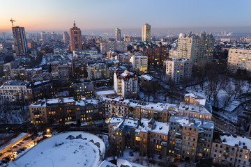 Top view of old and new buildings in the center of Kiev, Ukraine at evening in winter.