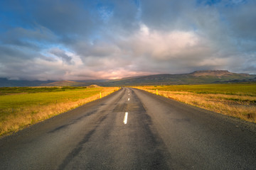 Isolated road and Icelandic landscape at Iceland, summer