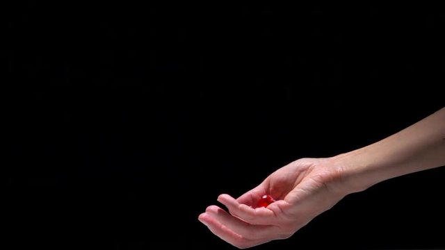 Hand throwing dice in slow motion. Concept film clip of chance, risk and success.