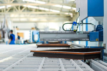 Automatic corner cleaning machine for PVC windows and doors sections with a window