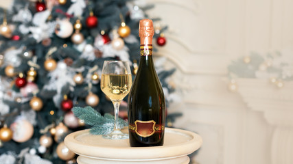 Wine in Christmas setting. New Year decorations. Winter holidays theme.