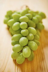 Grapes on wooden table