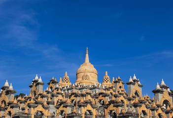 Fototapeta na wymiar Sandstone pagoda on blue sky in wat Pa Kung temple at Roi Et of Thailand