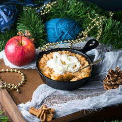 Apple crumble with cream as Christmas home made dessert