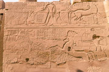 LUXOR, EGYPT: Ancient ruins of Karnak temple in Egypt at noon. The complex is a vast open-air...