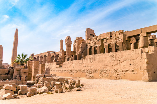 LUXOR, EGYPT: Ancient ruins of Karnak temple in Egypt at noon. The complex is a vast open-air museum, and the second largest ancient religious site in the world