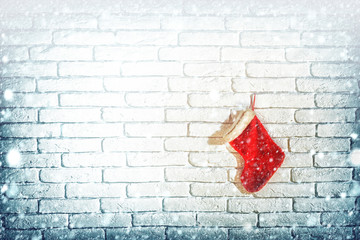 christmas stocking on brick wall