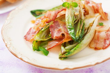 Baked chicory with bacon, onions and herbs.