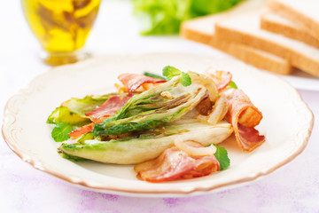 Baked chicory with bacon, onions and herbs.