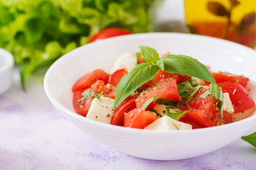 Fresh salad with tomato, mozzarella and basil