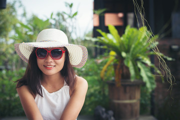 Portrait of charming woman relaxing on the deck chair outdoors w