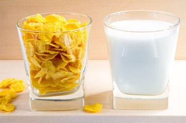 Cornflakes and milk in glass cups