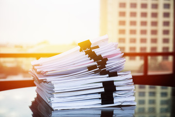 Pile of unfinished documents on office desk, Stack of business paper