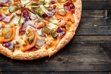 Italian pizza on wooden table