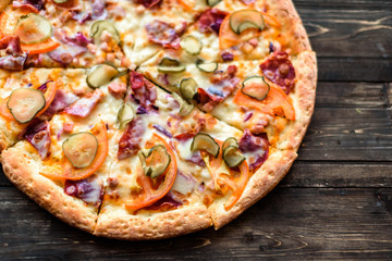 Italian pizza on wooden table