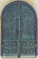 old church textured door with stone arch facade