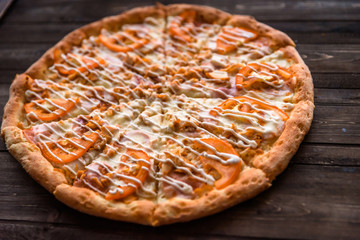 Italian pizza on wooden table