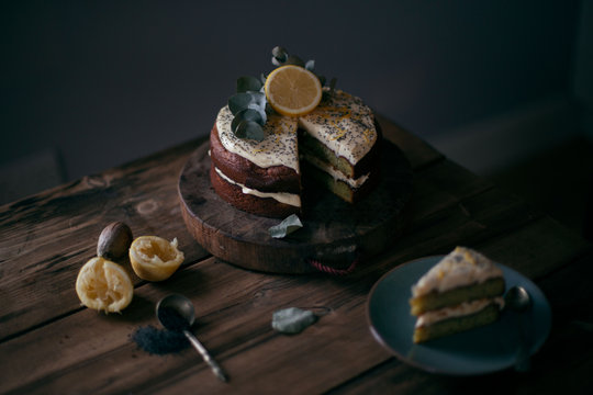 Avocado lemon poppyseed cake on wooden table