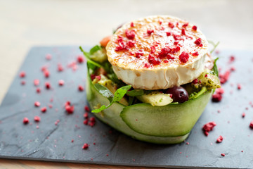 goat cheese salad with vegetables at restaurant