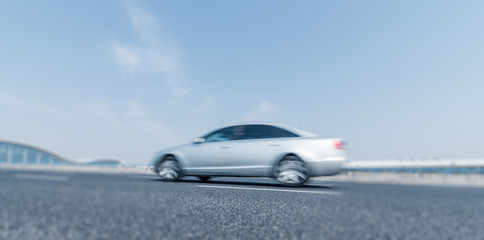 Fototapeta na wymiar motion blurred car on a highway