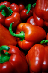 Fresh red sweet bell peppers close-up