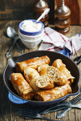 Crepes stuffed with minced meat and rice