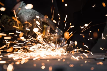 Fotobehang Hot sparks from grinding steel material © skinfaxi