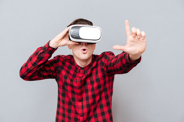 Surprised man in virtual reality device