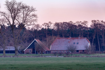 Dutch rural winter landscape with frozen farm. Achterhoek. Gelde