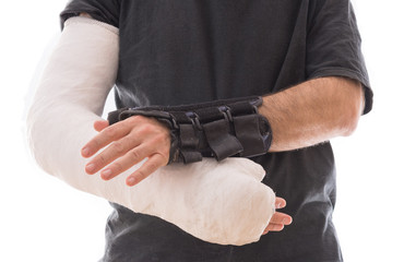 Young man wearing a long arm cast and a splint